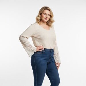 Long sleeve ribbed knit top with crochet lace sleeves and asymmetrical neck line